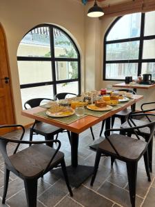 a wooden table with food on it in a kitchen at Ruka Maldives in Dhiffushi