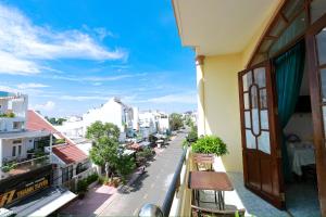 a view of a city street from a balcony at Hotel Ngọc My in Phan Thiet
