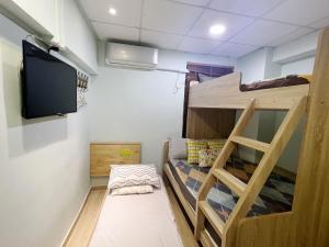 Televiisor ja/või meelelahutuskeskus majutusasutuses AMU Dreamhouse 阿木旅舍