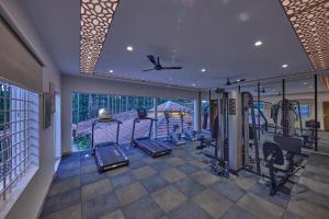 an image of a gym with cardio equipment in a house at Regenta Resort Sakleshpur in Sakleshpur +93 photos
