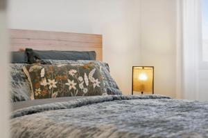 a bedroom with a large bed with a wooden headboard at The Crystal Palace 2 in Jindabyne