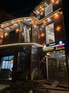 a building with a sign on it at night at Hotel S!ya Ram Ayodhya Near Ram Janam Bhoomi & Temple - fully Air Conditioned hotel at Prime Location - Parking-Wi-Fi -Lift Facilities - Best Hotel In Ayodhya in Ayodhya