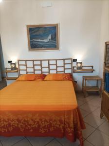 Postel nebo postele na pokoji v ubytování Relais Frantoio delle Pietre