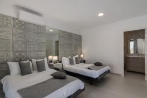 Ένα ή περισσότερα κρεβάτια σε δωμάτιο στο Apartamentos Luxury Cristina
