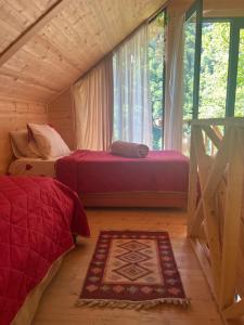 a bedroom with two beds and a window at Villa lugela in Mukhuri