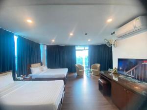 Ένα ή περισσότερα κρεβάτια σε δωμάτιο στο A25 Hotel - 251 Hai Bà Trưng HCM