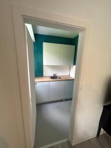 a bathroom with a sink and a mirror at cosy studio in Montreux