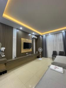 a hotel room with a bed and a large mirror at Ruby 3 Hotel in Hanoi
