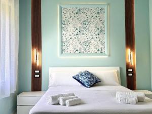 Postel nebo postele na pokoji v ubytování B&B Riviera Azzurra