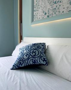 Postel nebo postele na pokoji v ubytování B&B Riviera Azzurra
