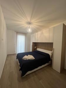 a bedroom with a bed with two pillows on it at FraMì apartment in Bari