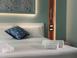 Postel nebo postele na pokoji v ubytování B&B Riviera Azzurra