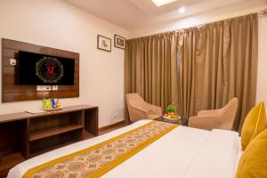 Postel nebo postele na pokoji v ubytování Sandoz Palm Retreat - Mall Road, Mussoorie