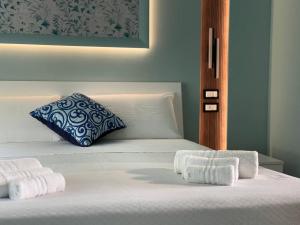 Postel nebo postele na pokoji v ubytování B&B Riviera Azzurra
