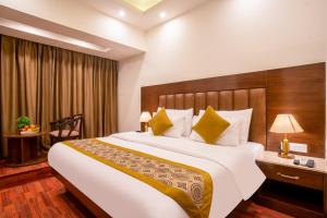 Postel nebo postele na pokoji v ubytování Sandoz Palm Retreat - Mall Road, Mussoorie