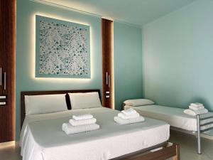 Postel nebo postele na pokoji v ubytování B&B Riviera Azzurra
