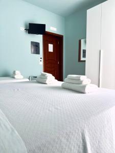 Postel nebo postele na pokoji v ubytování B&B Riviera Azzurra
