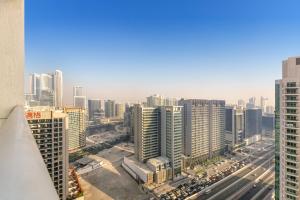 an aerial view of a city with tall buildings at Burj Al Nujoom Luxurious Apartment Downtown Dubai Mall in Dubai