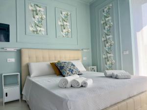 Postel nebo postele na pokoji v ubytování B&B Riviera Azzurra