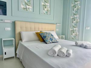 Postel nebo postele na pokoji v ubytování B&B Riviera Azzurra