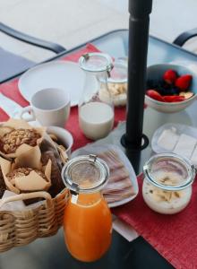 a table topped with food and a basket of fruit at Canhoto Douro in São Lourenço do Douro +20 photos