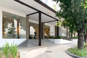 an office building with glass doors and stairs at Ayala Cebu Solinea in Cebu City