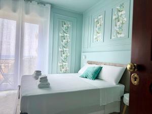 Postel nebo postele na pokoji v ubytování B&B Riviera Azzurra