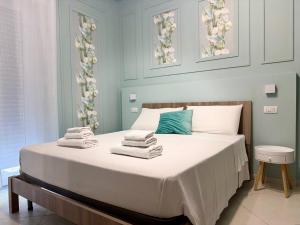 Postel nebo postele na pokoji v ubytování B&B Riviera Azzurra