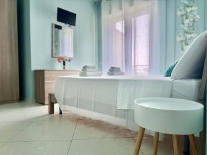 TV a/nebo společenská místnost v ubytování B&B Riviera Azzurra