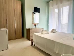 Postel nebo postele na pokoji v ubytování B&B Riviera Azzurra