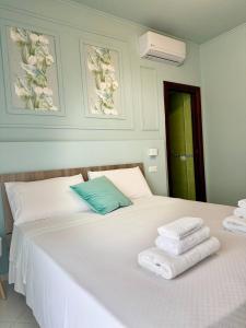 Postel nebo postele na pokoji v ubytování B&B Riviera Azzurra