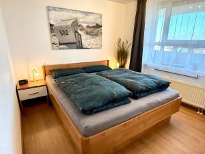 Katil atau katil-katil dalam bilik di Ferienwohnung De Kraan