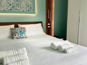 Postel nebo postele na pokoji v ubytování B&B Riviera Azzurra