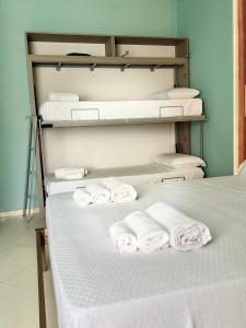 Postel nebo postele na pokoji v ubytování B&B Riviera Azzurra