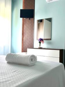 Postel nebo postele na pokoji v ubytování B&B Riviera Azzurra
