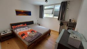 Postel nebo postele na pokoji v ubytování Ferienwohnung Meiringen