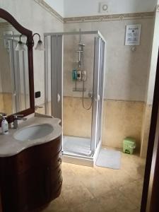 a bathroom with a shower and a sink at Locazione turistica Casa Peppe in Manduria