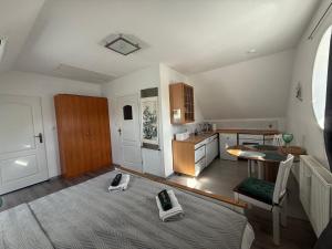 a room with a kitchen and a living room at U Marka in Dąbrowy