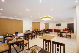 a dining room with tables and chairs in a restaurant at Hotel Lungpa Valley in Leh