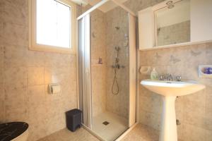 a bathroom with a shower and a sink at Cottage-Casolare pugliese in San Vito dei Normanni +45 photos