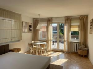 Posteľ alebo postele v izbe v ubytovaní Apartamenty Studio