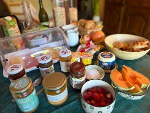 a counter top with various food items on it at Arduinna's Nest B&B in Neufchâteau