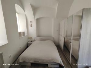 Postel nebo postele na pokoji v ubytování Apartmán U kostela + 3 fotografie