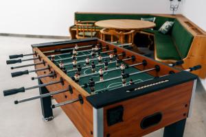 a foosball table with a chessboard at Danner Appartements Wolfsegg am Hausruck- Ferienwohnung & Business-Appartements Ruhige Lage, moderne Ausstattung, faire Preise in Wolfsegg am Hausruck +14 photos