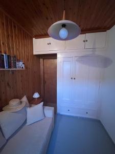 a living room with a couch and a ceiling at Captain's House Plomari in Plomari +27 photos