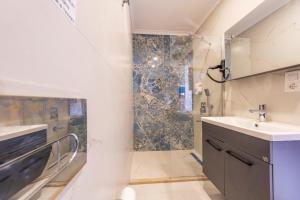 a bathroom with a sink and a shower at Katre Hotel Oludeniz in Oludeniz +48 photos