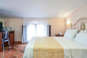 Ліжко або ліжка в номері Hotel Palazzo Krataiis