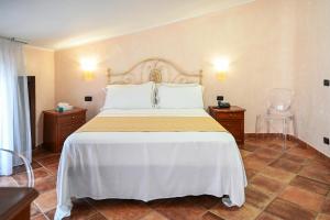 Ліжко або ліжка в номері Hotel Palazzo Krataiis