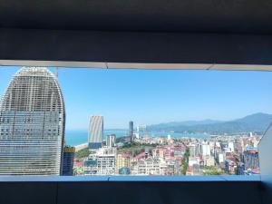 a view of a city from a window at Li Apartments Batumi in Batumi