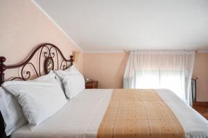 Ліжко або ліжка в номері Hotel Palazzo Krataiis